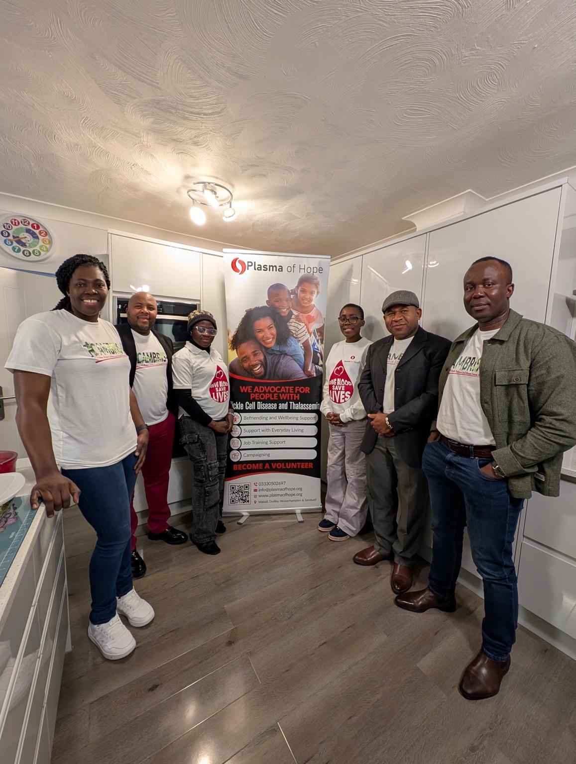 Group photo of CAMBRIS-AF members and Plasma of Hope representatives during a community support and inclusion engagement.